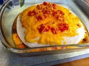 Top view of layered taco bake before going into oven.