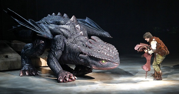 Hiccup (Rarmian Newton) fixes Toothless' tail, photo credit Jeff Busby