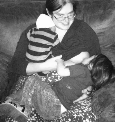 Snuggle one, nurse the other.