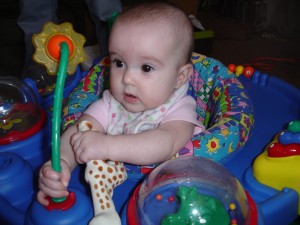 Rissa in the exersaucer we got from Freecycle in April 2011.