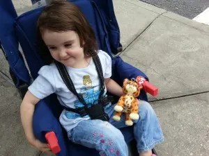 toddler girl in stroller