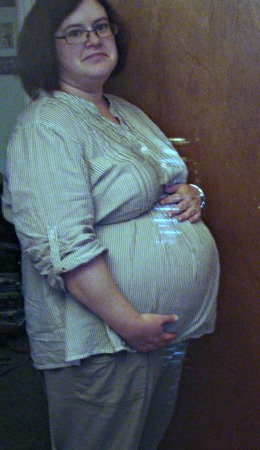 side shot of a 31 week baby bump