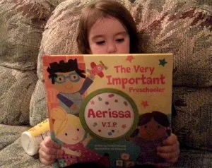 girl holding up book