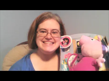 woman holding bedtime peppa doll