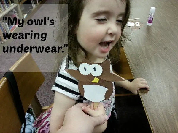 toddler holding up owl craft #shop