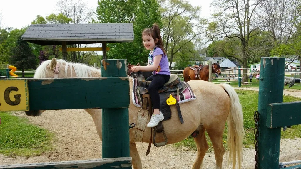Darcy's daughter on pony ride at Green Meadows Farm