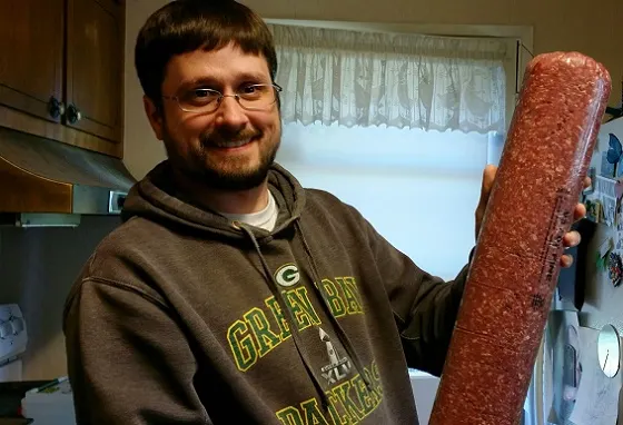 Brian holding ground beef.