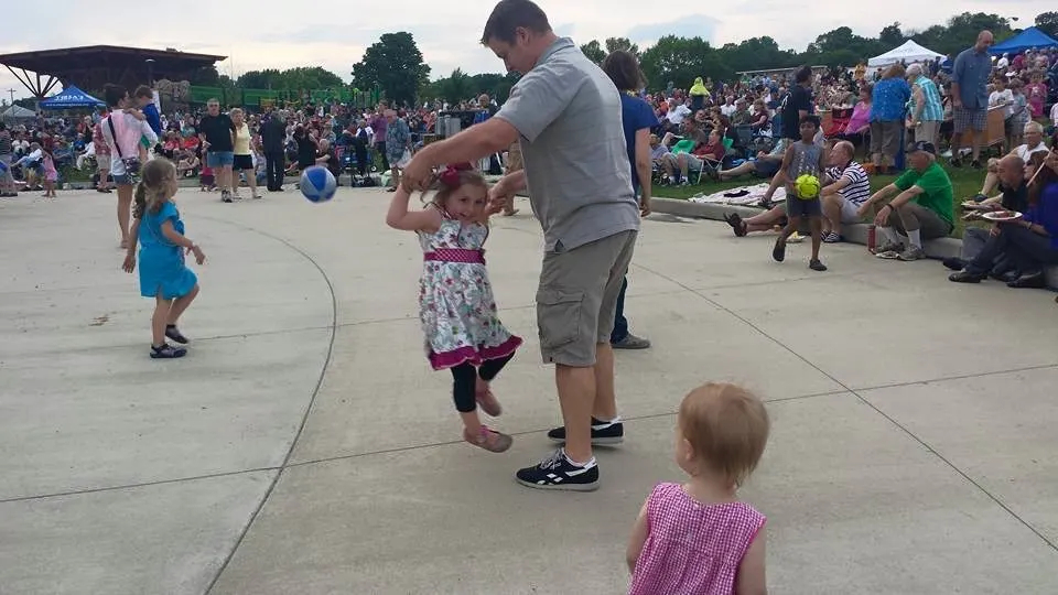 Daddy and daughter dancing at live music event in Wauwatosa.