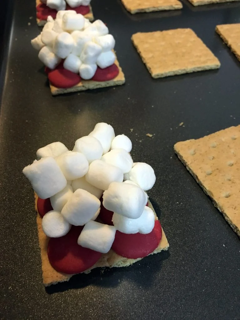Preparing Christmas S'mores for the oven