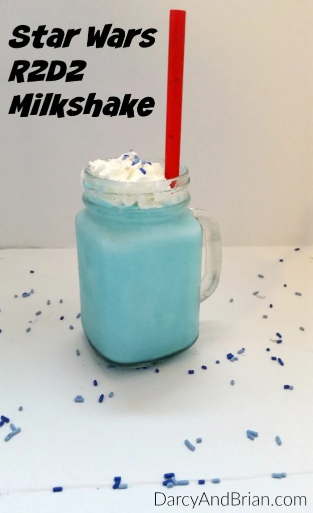 Blend up this Star Wars R2D2 Milkshake recipe. Add red milkshake straws to look like lightsabers for added fun. This Star Wars recipe is perfect for kids birthday parties and movie nights!