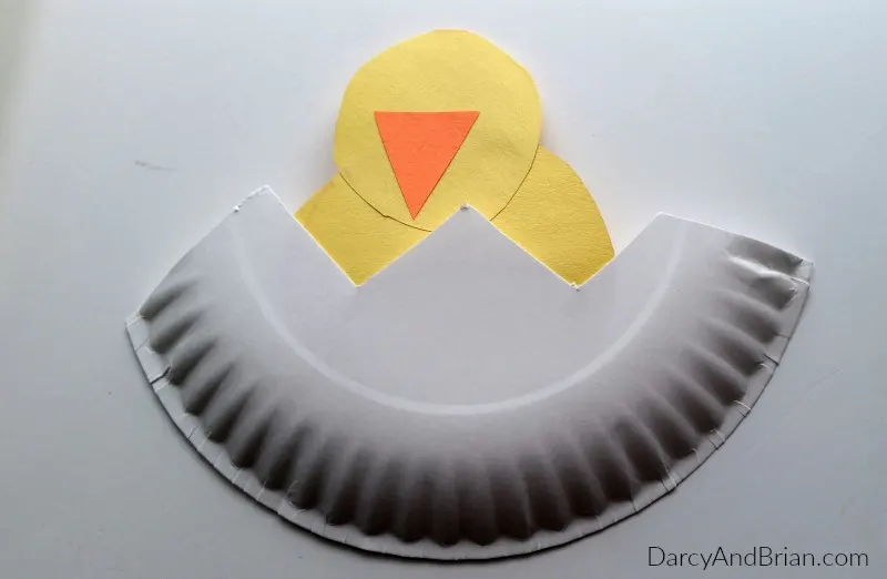 Glue the chicken to the bottom of the paper plate, then decorate!