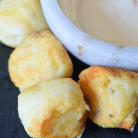 Scrumptious baked cheesy potato bombs are ready to be eaten.