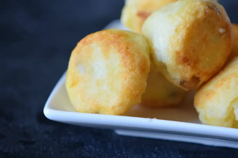 Don't settle for boring mashed potatoes. Make these cheesy potato bombs instead!