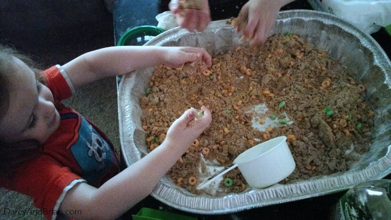 Play dirt is an easy to set up invitation to play and sensory activity.