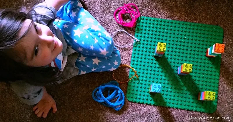 Make learning fun with a DUPLO ring toss game.