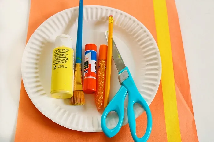 Craft supplies you need to make this preschooler sun craft.