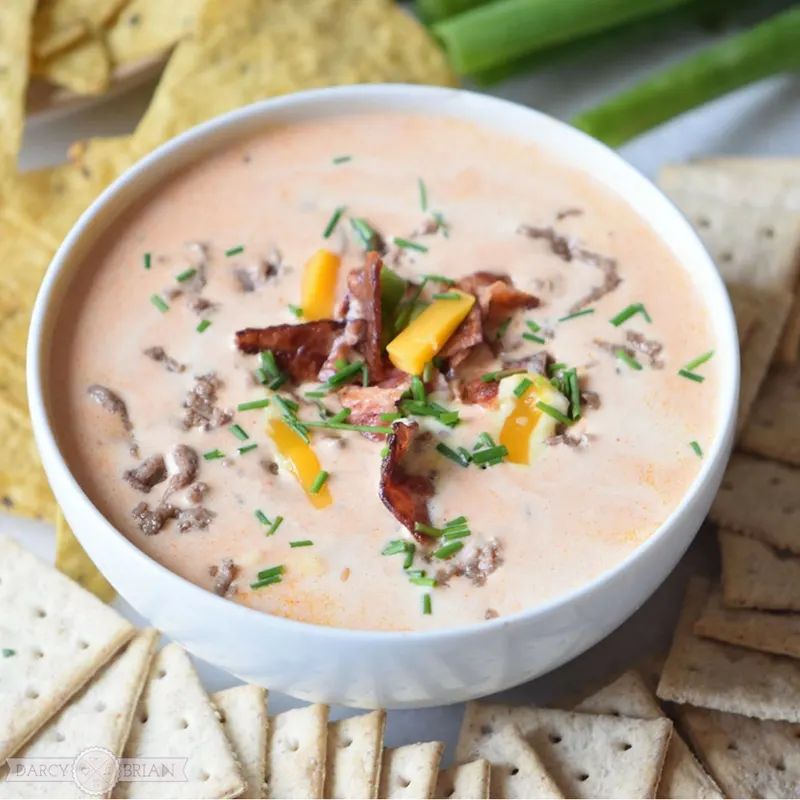 Score major points with this mouthwatering Bacon Cheeseburger Dip recipe. It's a quick and easy party dip that will please your guests. Perfect for game day too!