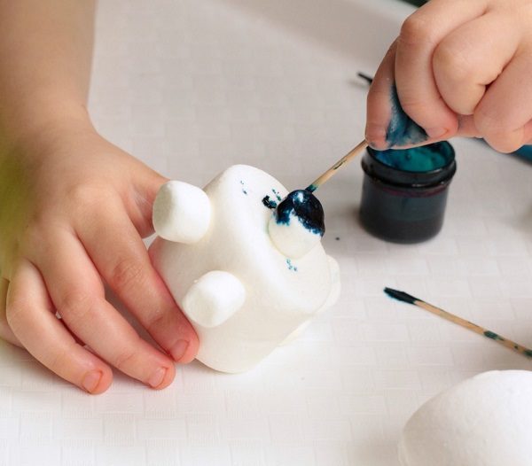 Fun food craft for kids making polar bears out of marshmallows