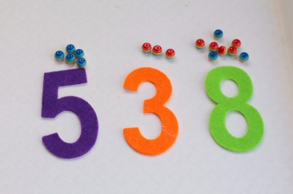 Looking for quick and easy kids activities? If your kids love rainbows, then they will jump at the chance to try this fun rainbow fine motor counting activity. Great way to work on learning numbers and colors too!