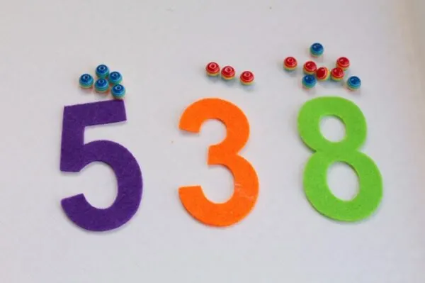 Looking for quick and easy kids activities? If your kids love rainbows, then they will jump at the chance to try this fun rainbow fine motor counting activity. Great way to work on learning numbers and colors too!