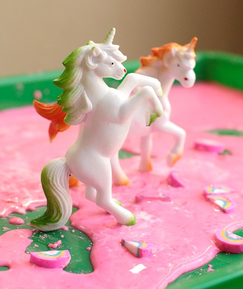 Setting up unicorn sensory bin for kids