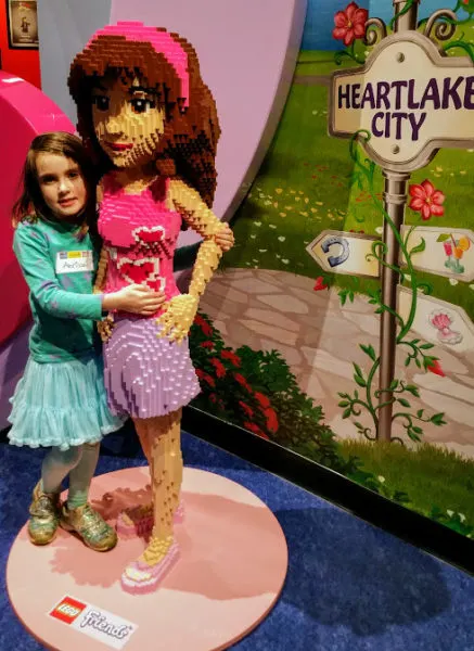 My daughter posing with LEGO Friends model at LEGOLAND