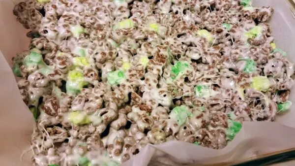 Recipe to make crispy treats with chocolate Lucky Charms cereal.