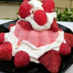 Strawberry angel food cake topped with strawberries and raspberries. Easy to make when all the ingredients are delivered.