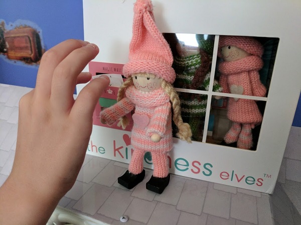 Little girl checking Kindess Elves mailbox
