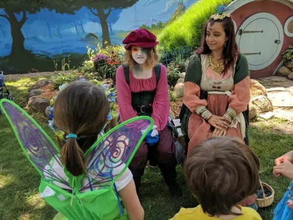 Kids interact with cast members as part of the KidsQuest adventure at RenFaire