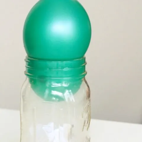 Balloon getting sucked into mason jar during air pressure experiments