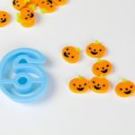 Number recognition activity for kids using pumpkin mini erasers.