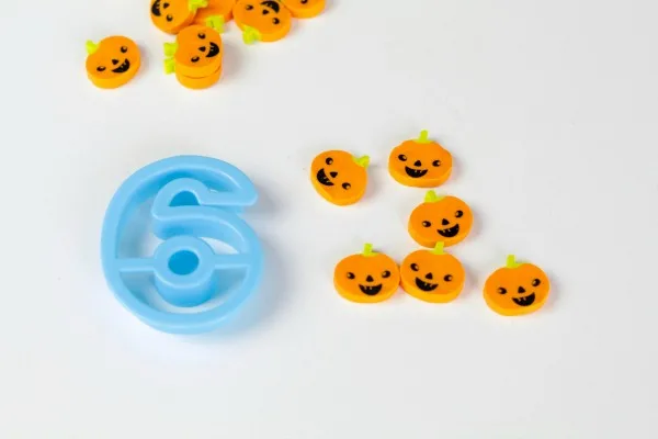 Number recognition activity for kids using pumpkin mini erasers.