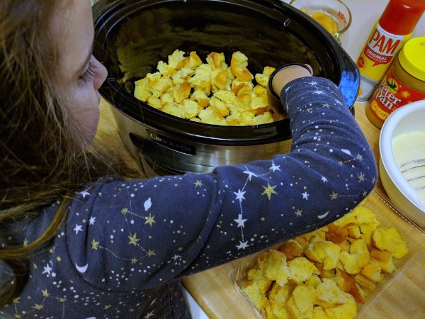 Daughter helping with crockpot dessert recipe