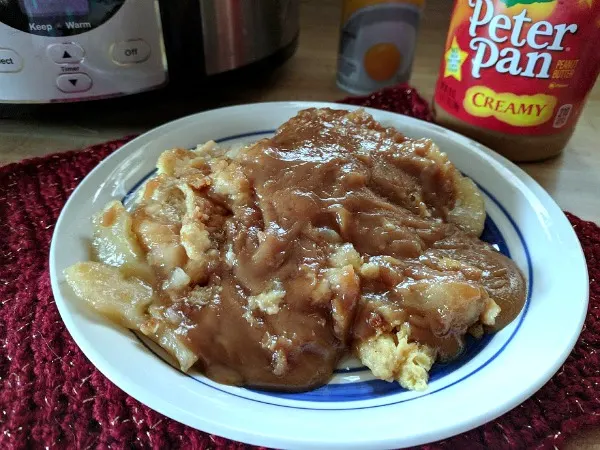 This is so good and so easy to make! Enjoy fall with this easy and delicious Crockpot Apple Pie Bread Pudding Recipe with a warm peanut butter sauce. The perfect fall slow cooker dessert! {AD} #RecipesThatCrock #SeasonalSolutions #CollectiveBias