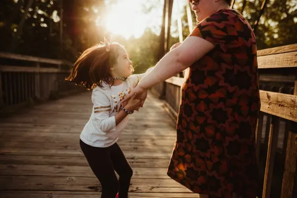 Darcy and her daughter dancing during photo session.