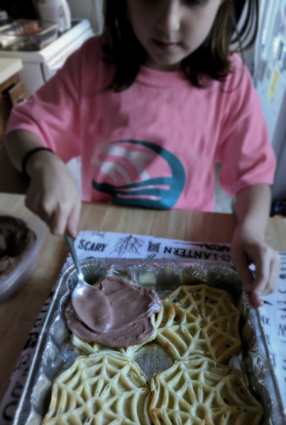 Daughter helping with easy no bake Halloween dessert recipe