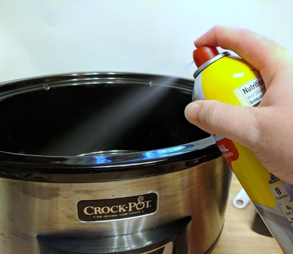 Greasing inside of slow cooker with PAM Spray Pump