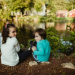Author's daughter and son looking mischievous by the creek.