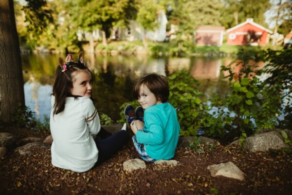 Author's daughter and son looking mischievous by the creek.