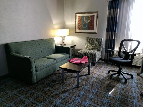 Sitting area in hotel room at Holiday Inn Express Janesville