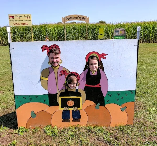 Family photo opp at Skelley's Farm Market and Corn Maze