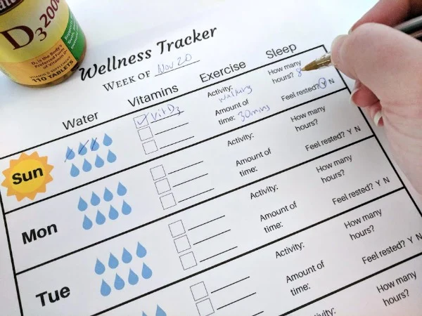 Filling out weekly wellness tracker printable