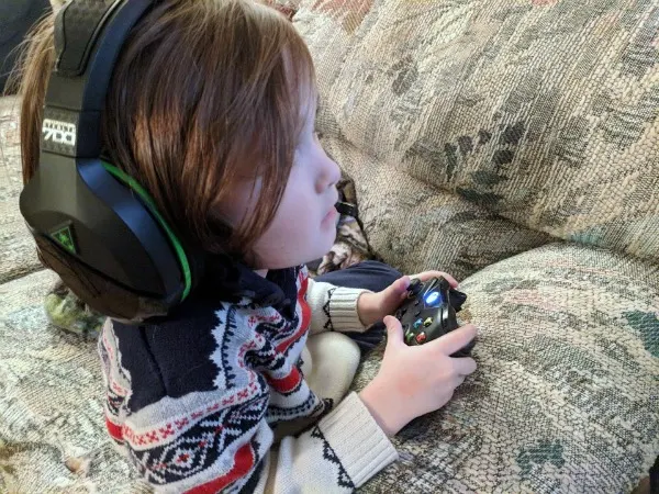 My son wearing Stealth 700 gaming headset while playing Xbox
