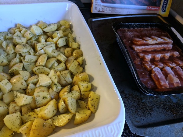 Preparing On-Cor freezer meal and roasted potatoes for a side dish.