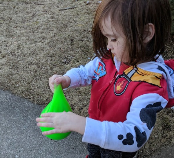 Xander playing with the huge Wubble Fulla Slime for screen-free play time.