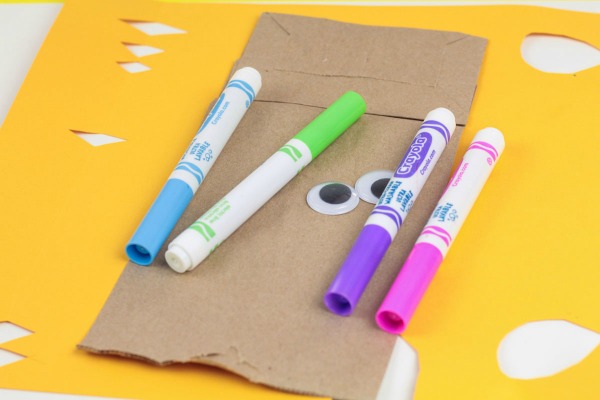 Craft supplies to make a paper bag unicorn.