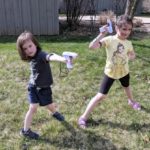 The kids ready to play laser tag in the backyard