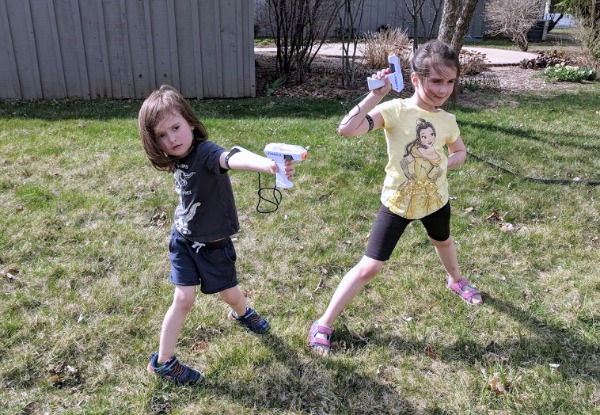 The kids ready to play laser tag in the backyard