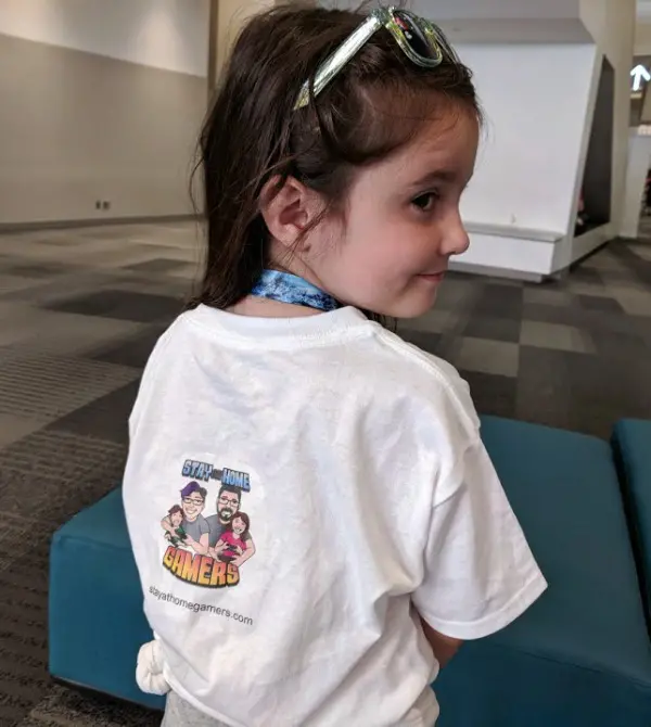 My daughter wearing our Stay At Home Gamers t shirt at Origins Game Fair.